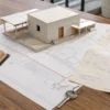 Modello di edificio su planimetrie per la sanatoria dopo l’acquisizione al Comune